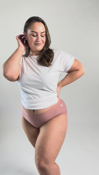 Model wearing Pink Seamless briefs and white t-shirt.